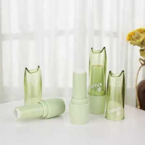 Unique gradient pink and gold lipstick tube with a slanted cap, customizable with printing and a pump cap, perfect for cosmetic lip gloss packaging.